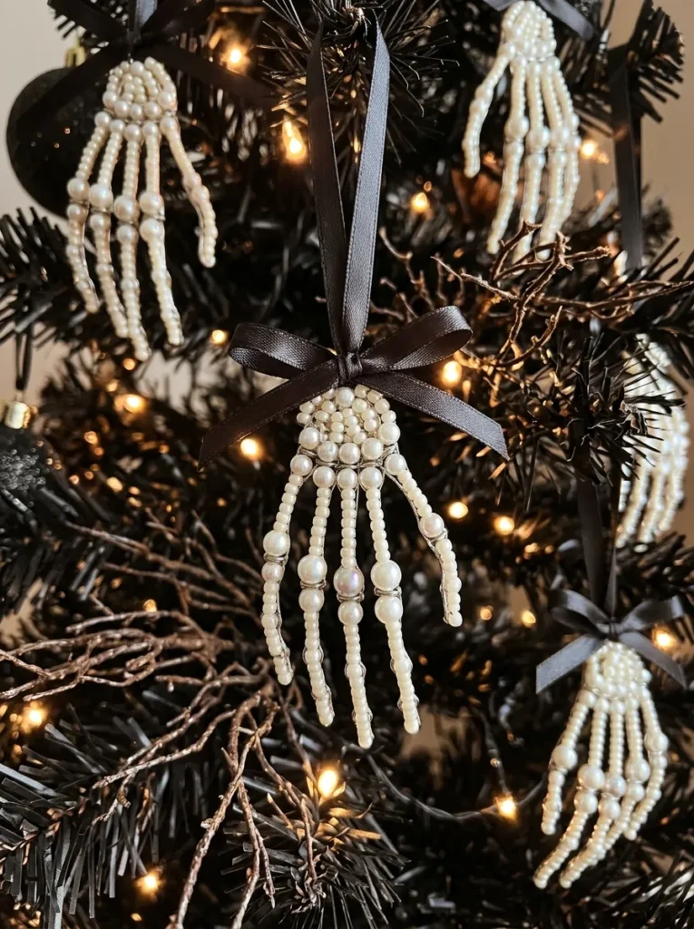 Beaded Pearl Skeleton Hand Drops - halloween ornament (Articulated skeleton hand ornaments crafted from faux pearl beads holding black obsidian crystal globes)